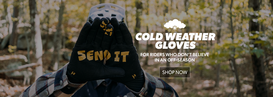 Cold weather gloves with 'Send It' branding held by a person in a forest setting, promotional text overlay.