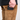A close-up of a person wearing brown corduroy pants and a black shirt, showing a black textured leather wallet or card holder tucked into the side pocket.