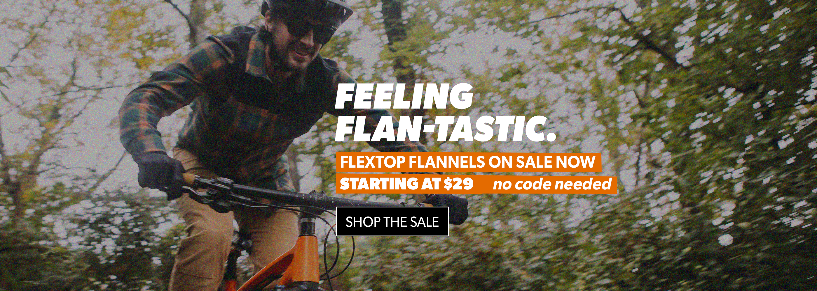 Man riding a bike with promotional text overlay in a forest setting