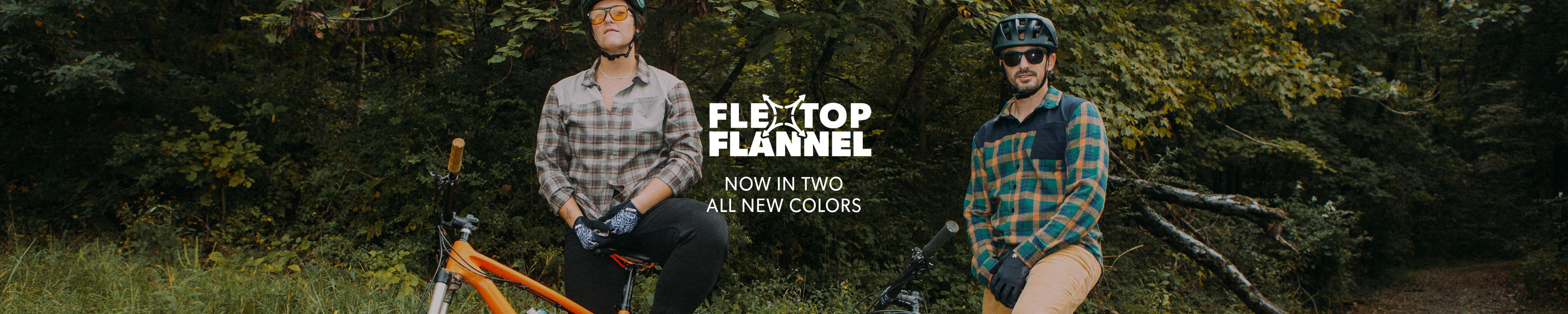 Two people in plaid shirts with a bicycle in a forest setting, promoting 'Flextop Flannel' clothing.