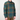 A man wearing a green and brown plaid button-down flannel shirt, shown from the neck down against a plain light gray background.