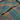 A close-up of a plaid fabric, likely a flannel shirt or scarf, featuring a pattern of green, rust orange, and purple-blue stripes.