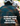 A person seen from behind wearing a green and brown plaid flannel shirt and a white bicycle helmet, with large white text over the center reading, 'YOUR FAVORITE FLANNEL, NOW WITH BACK VENTILATION.' Another helmeted rider is blurred in the background.