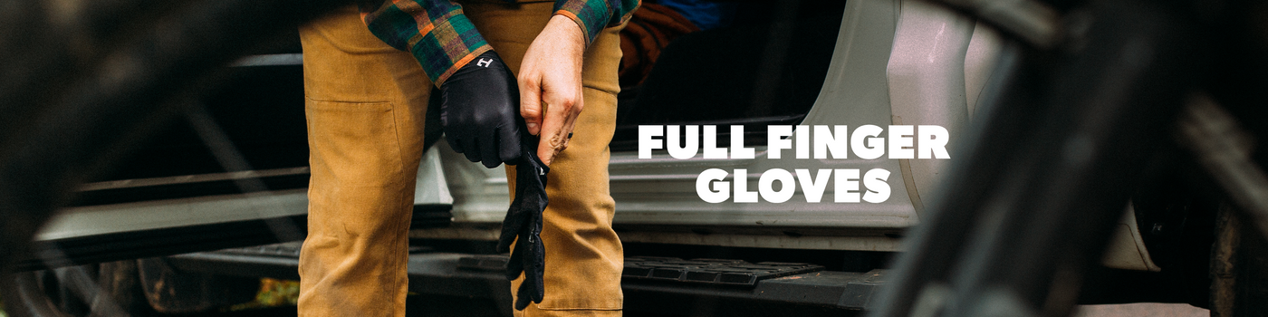 Person wearing full finger gloves with text 'FULL FINGER GLOVES' in a blurred outdoor setting.