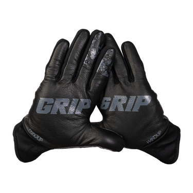 A pair of black leather winter gloves with 'GRIP' printed in gray on the back of the hands, displayed against a solid white background.