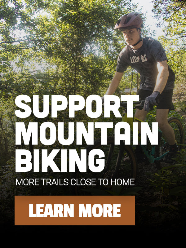 Person mountain biking with text encouraging support for mountain biking trails.