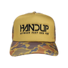 Yellow and camouflage trucker hat with 'HANDUP' logo on a white background