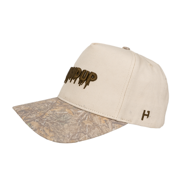 Beige cap with camouflage brim and logo on a white background