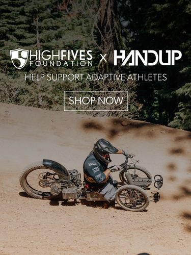 Person on a custom bike in a natural setting with 'High Fives Foundation' and 'Handup' branding.