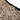 Close-up of a garment with a dalmatian print and a visible brand label.