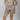 Person wearing a matching leopard print shirt and shorts set on a gray background