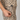 Person wearing a leopard print outfit with 'Handup' branding on a plain background