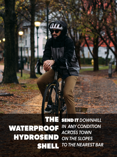 Person riding a bicycle on a path with autumn leaves and trees in the background.