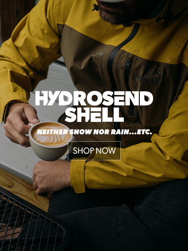Person wearing a yellow and brown jacket holding a coffee cup, with promotional text overlay.