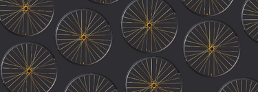 Pattern of bicycle wheels on a dark background