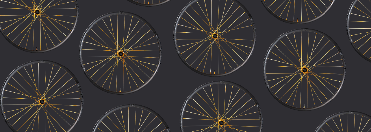 Pattern of bicycle wheels on a dark background