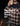 Man wearing a plaid jacket by a campfire with text promoting outerwear.