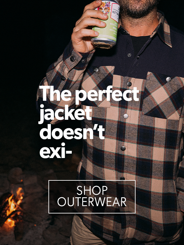 Man wearing a plaid jacket by a campfire with text promoting outerwear.