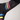 Black athletic sleeve with colorful stripes on a gray background