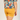 Person wearing mustard yellow shorts and a colorful floral shirt on a plain background
