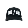Black cap with white text and logo on a white background