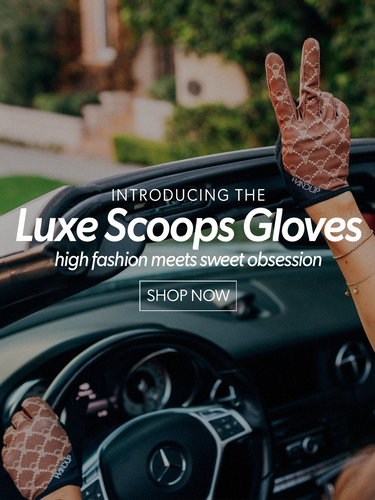 Person wearing Luxe Scoops Gloves with a car in the background