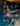 Person lounging by a pool with text overlay 'Shop All Spring 2026' in an indoor setting.