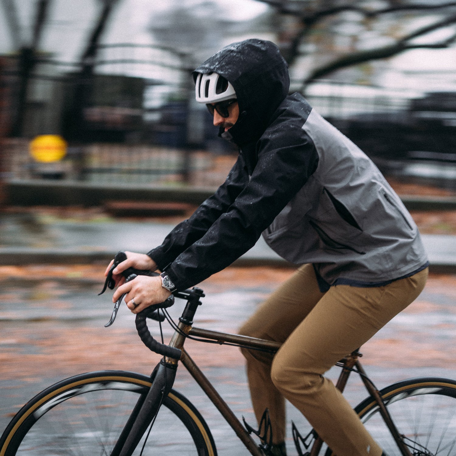 Person riding a bicycle on a rainy day