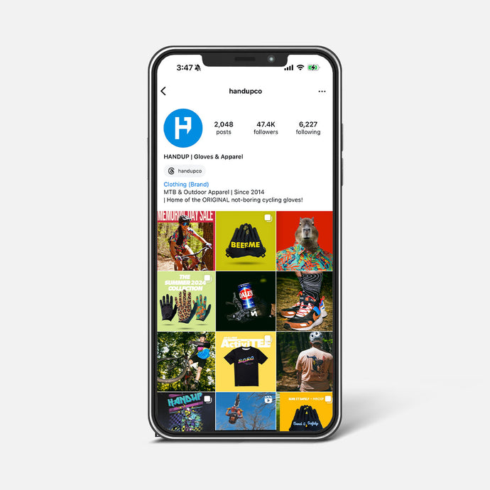 Phone displaying the Handup Gloves & Apparel Instagram profile on a white background