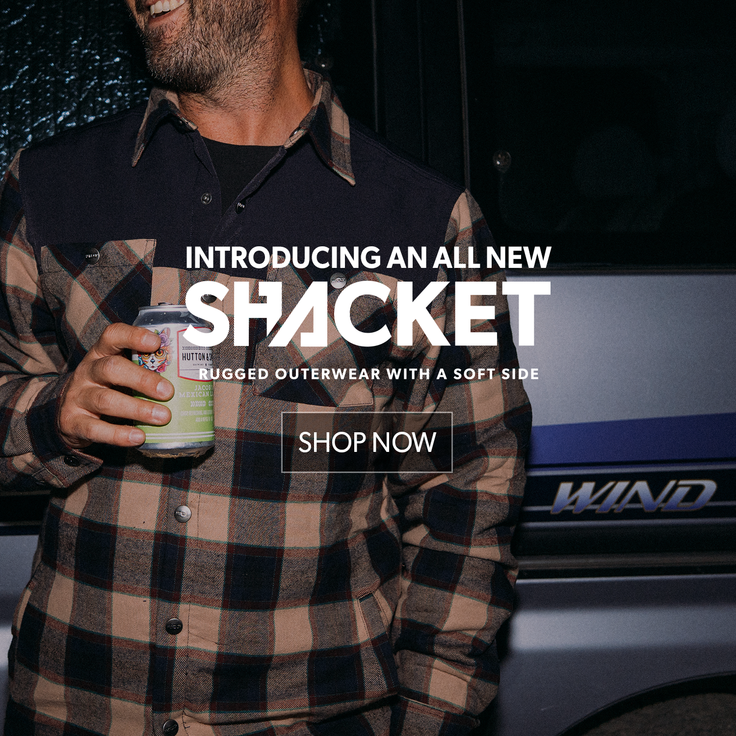 Man wearing a plaid shirt holding a can, with promotional text for 'Shacket' clothing.