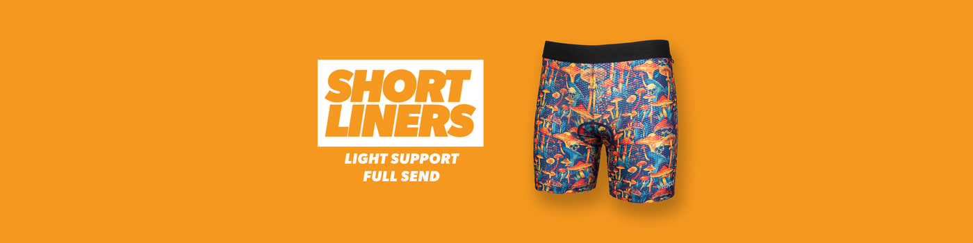 Colorful cycling short liners with 'Short Liners' branding on an orange background