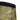 Textured fabric with yellow pattern and black trim on a white background