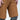 Close up of a man wearing brown shorts, featuring in seam vents