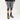a man wearing grey mountain bike shorts, knee pads, mountain bike shoes and black long sleeve shirt on a white background
