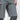A man wearing grey trail shorts featuring a vented inseam