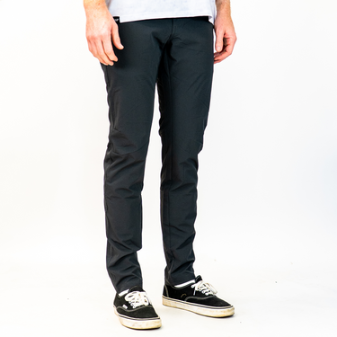Person wearing black tech pants
