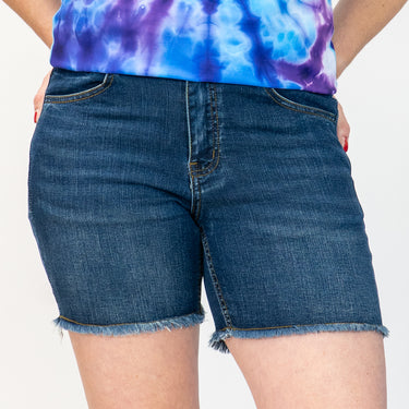 person wearing blue denim jean shorts