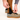 Person adjusting a shoe with a white background