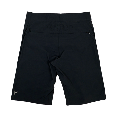 the back of a pair of black mountain bike shorts with a stretch waistband and multiple zip-pockets.