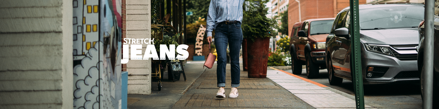 Person walking on a sidewalk with 'Stretch Jeans' text overlay