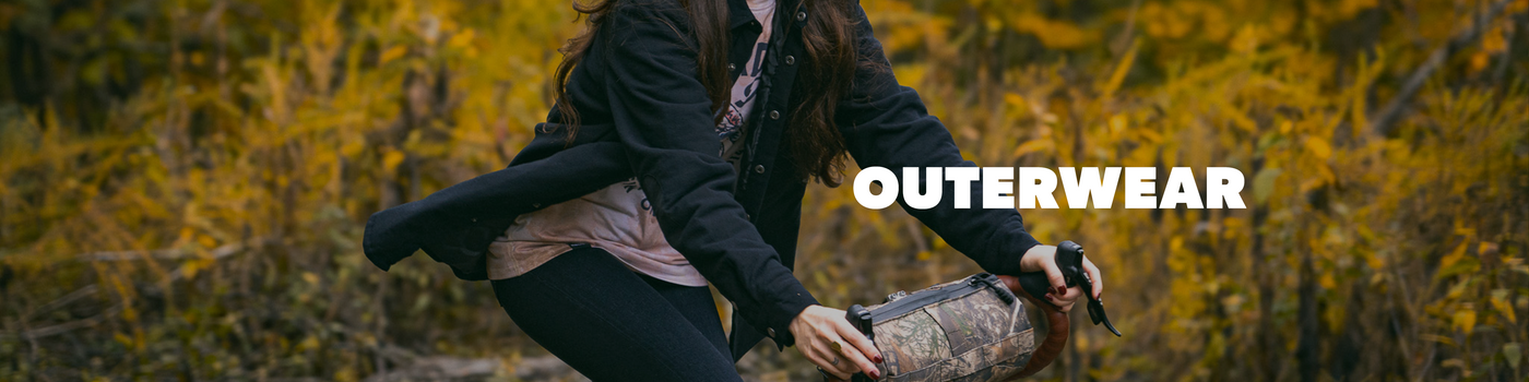 Person holding a jacket with 'Outerwear' text in an autumnal setting