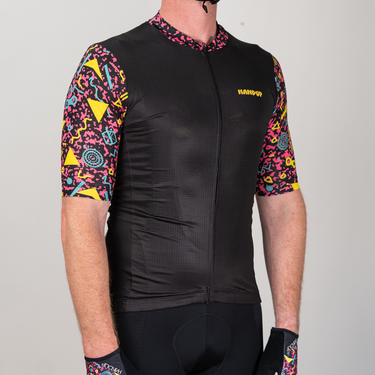 Black cycling jersey with colorful patterns on sleeves and collar, featuring the brand 'Kangui'.