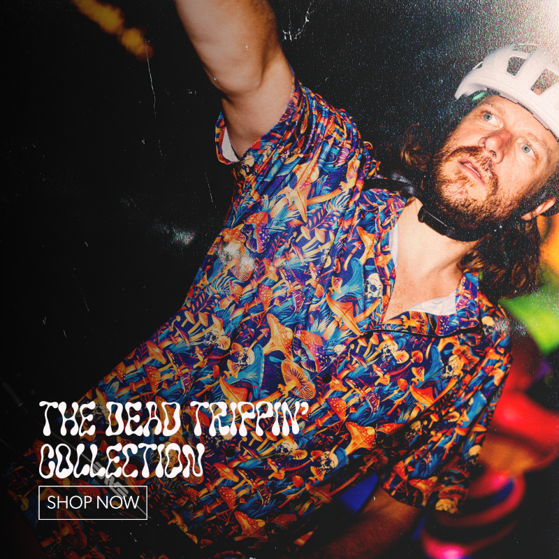 A man wearing a colorful abstract-patterned shirt and a white helmet looks upward in a dark, moody setting. Large text at the bottom reads 'THE DEAD TRIPPIN' COLLECTION' with a 'SHOP NOW' box below it.