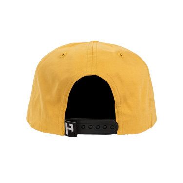 Yellow cap with a black adjustable strap on a white background