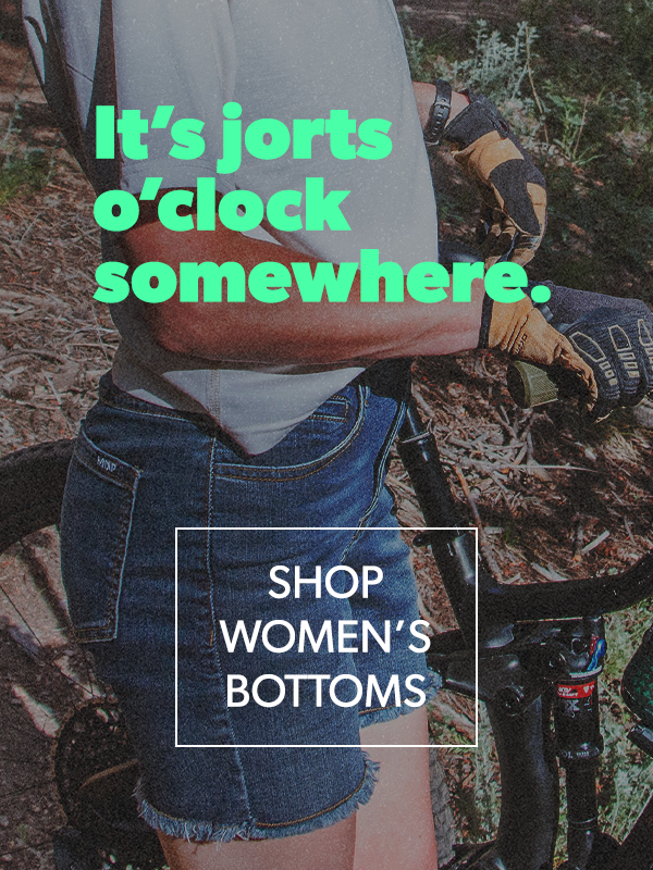 Person wearing denim shorts with text overlay and call to action for women's bottoms.