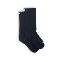 A pair of black socks with a visible white logo on the side.